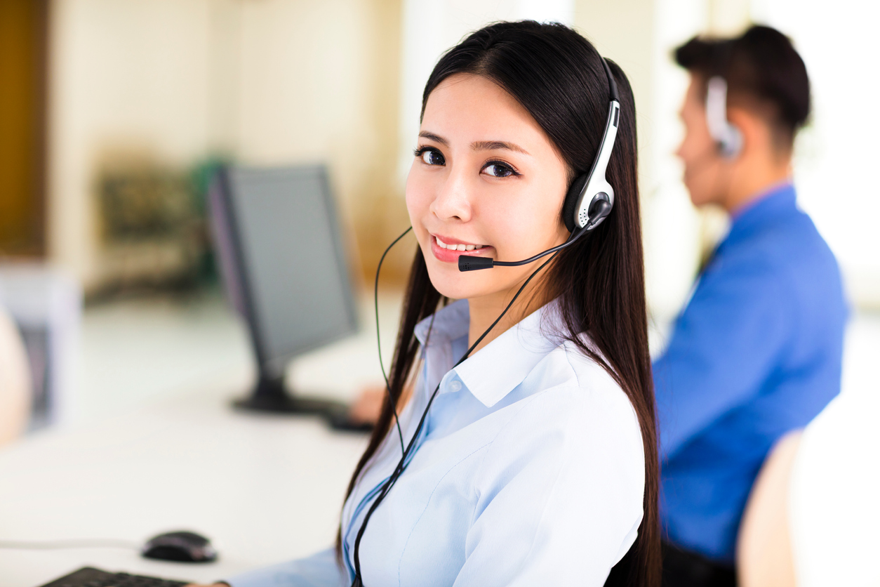 Beautiful call center agent working in office